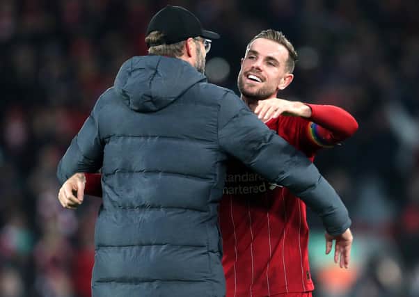 Liverpool captain Jordan Henderson with manager Jurgen Klopp. Pic by PA.
