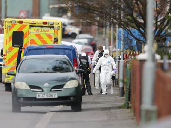 Police forensic officers at the scene of a shooting at a house on Etna Drive in the Ardoyne area of Belfast. The Police Service of Northern Ireland (PSNI) confirmed one man died in the shooting