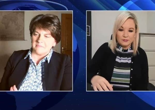 Arlene Foster (left) and Michelle O'Neill carried out their daily press briefing remotely from their own homes on Monday