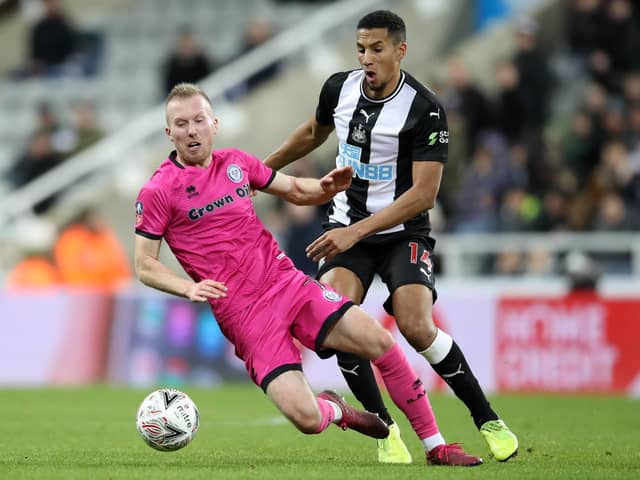 Stephen Dooley in action with Newcastle Uniteds Isaac Hayden