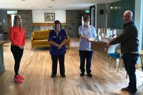 Manager of North West Regional College’s Product Design Centre Philip Devlin delivers the face guards to the Foyle Hospice