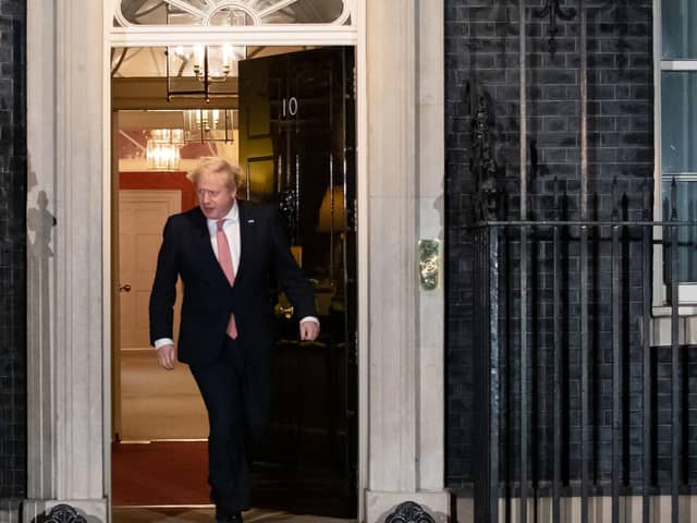File photo dated 26/03/20 of Prime Minister Boris Johnson (right) outside 10 Downing Street, London
