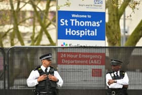 Police officers outside St Thomas' Hospital in Central London on Wednesday, where Prime Minister Boris Johnson remains in intensive care as his coronavirus symptoms persist.