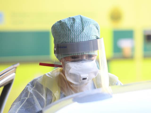 A nurse dressed in full personal protective equipment. Photo credit: Michael Cooper/PA Wire