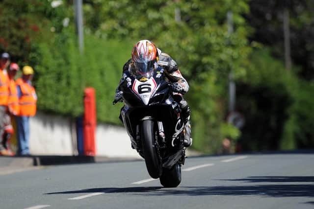 Cameron Donald at Ago's Leap on the Relentless TAS Suzuki at the 2008 Isle of Man TT.