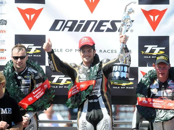 Cameron Donald celebrates his maiden Isle of Man TT win in the Superbike race in 2008 with runner-up Bruce Anstey (left) and Adrian Archibald.