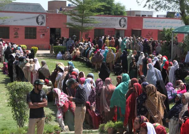Women wait for emergency cash in Pakistan during lockdown. Death rates are said to be much higher without treatment, which is a huge problem for poor nations with bad healthcare