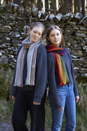 Lily and Saskia show off their rainbow scarves
