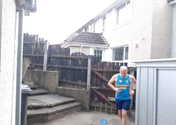 Ian Hillsdon running from Belfast to Dublin in his back yard