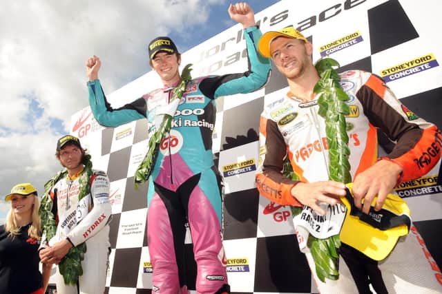 Conor Cummins celebrates his win in the feature Ulster Grand Prix Superbike race in 2009 with runner-up Guy Martin (left) and Ian Hutchinson.