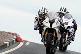 Michael Dunlop (Hawk BMW) leads William Dunlop (Tyco Suzuki) on the final lap of the opening Superbike race at the North West 200 in 2014.