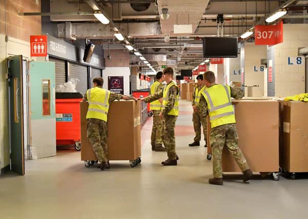 Soldiers involved in moving medical supplies at the Principality Stadium, Cardiff, which is being turned into a 2,000-bed hospital