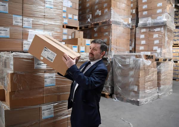 Health minister Robin Swann inspecting a large shipment of PPE last Monday, which was brought into NI via Liverpool from the central government