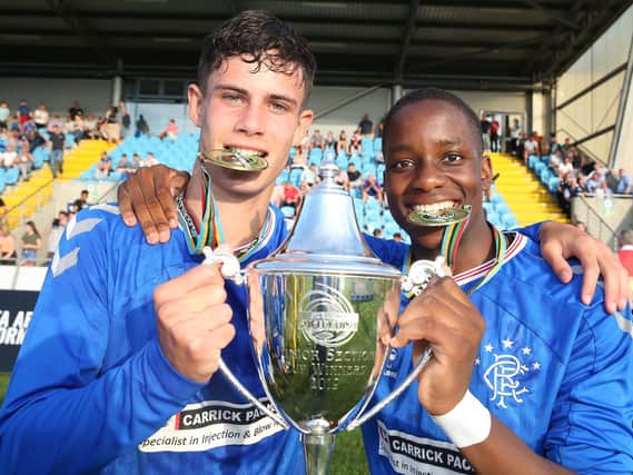 Robbie Ure and Adedire Mebude celebrate Rangers victory in the STATSports SuperCupNI Junior Final last year