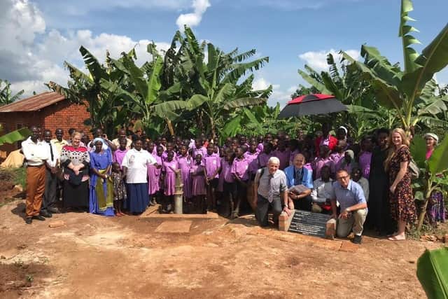 Missionaries, children from Emmanuel Christian School and local residents gathered for the special dedication service for the new borewell at Nsaalu village