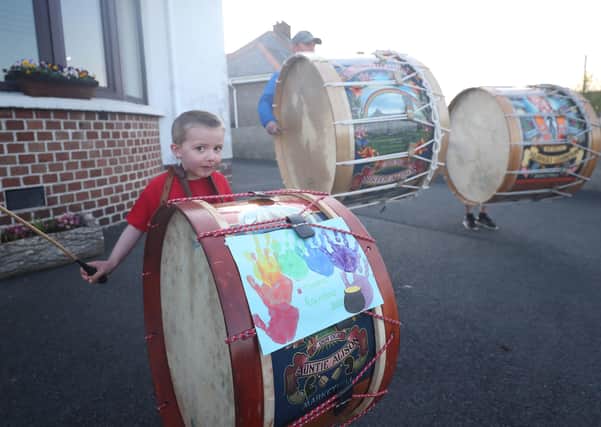 Thomas Black, four, from Market Hill in Co Armagh, Northern Ireland, bangs a Lambeg drum to salute local heroes during Thursday's nationwide Clap for Carers initiative to recognise and support NHS workers and carers fighting the coronavirus pandemic