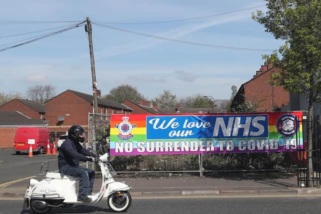A sign in the loyalist village area of South Belfast, outside the City Hospital which reads No Surrender to Covid-19. (Photo: PA Wire)