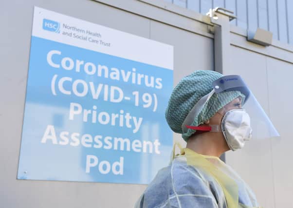 An Emergency Department Nurse during a demonstration of a Coronavirus pod and COVID-19 virus testing procedures.