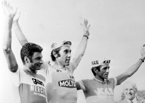 Eddy Merckx (centre) celebrates winning the 61st Tour de France ahead of Frenchman Raymond Poulidor (left) and Spain's Lopez Carril (right). Pic by PA.