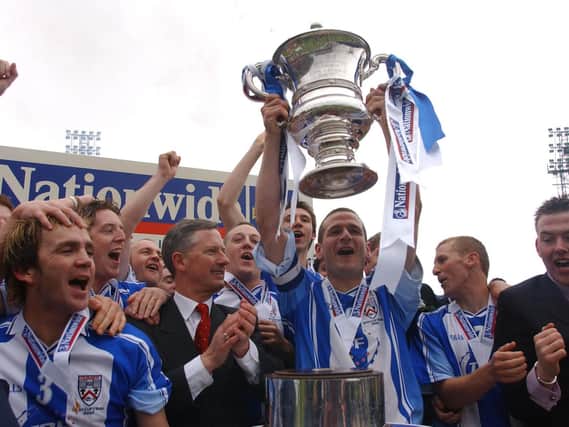 Pat lifting the Irish Cup for Coleraine in 2003