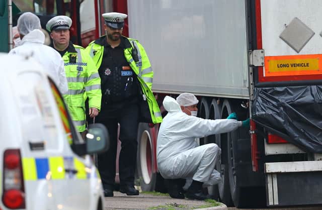 Police forensics officers at the Waterglade Industrial Park in Grays, Essex, after 39 bodies were found inside a lorry in October last year
