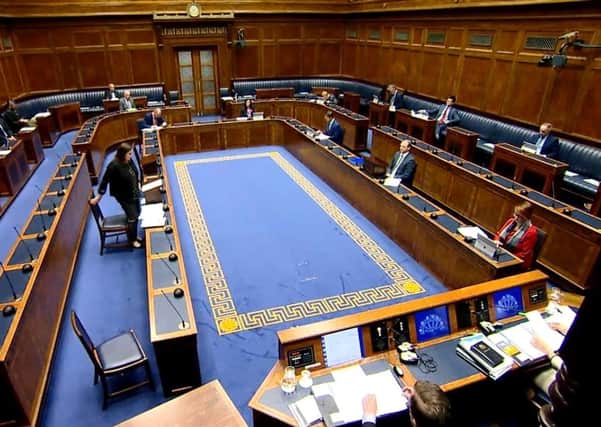 A scattering of MLAs were seated apart in the chamber for the debate