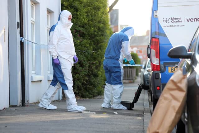 PACEMAKER, BELFAST, 22/4/2020: Forensic officers enter a flat in Haywood Avenue, Belfast where a woman's body was found in the early hours of the morning