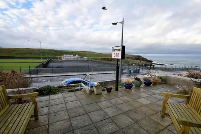 Features include a large westerly facing front terrace with views of the sea, Ramore Head and recreational grounds