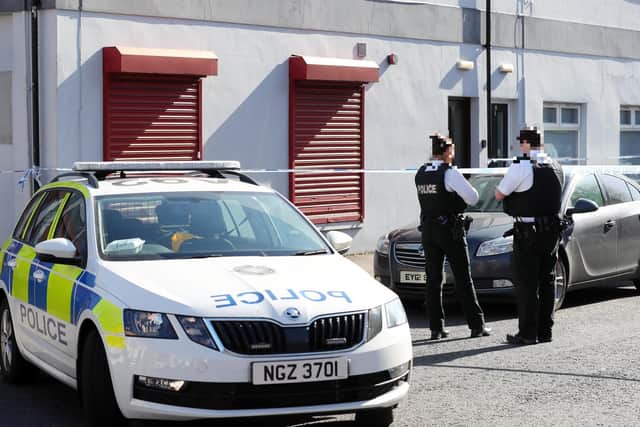 PSNI officers pictured near the flat where the body of a woman was discovered on Wednesday. (Photo: Presseye)