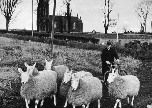 Pictured is the Reverend Robert John McIlmoyle with one of his 'flocks', he was a renowned sheep breeder and the minister of Reformed Presbyterian Church at Knockavallan. The photograph is taken from McIlmoyle of Dervock, Pastor of Two Flocks by Mid Antrim Historical Group (1991). Thanks for the advise from Peter Thompson of the Dervock and District History Group Facebook page (https://www.facebook.com/groups/1569745549911604/)