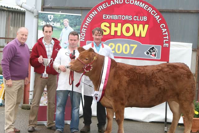 The cup for the best butchers-type heifer at the NICCEC 3rd annual show,Moira, went to Fergal and Declan McKenna from Clogher. Included are JackDobson and David Chestnutt, Dunbia, sponsors.