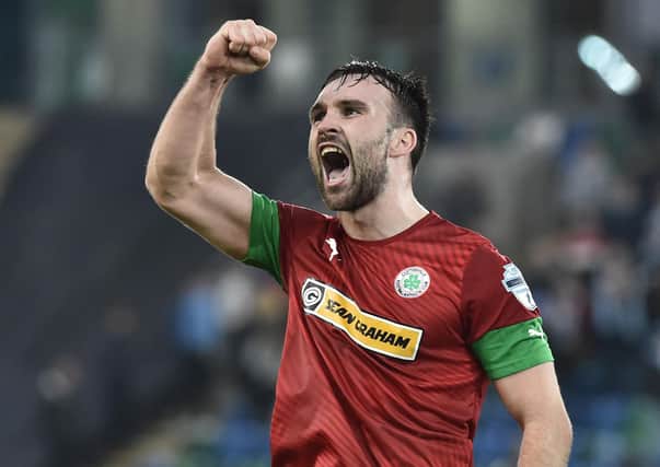 Cliftonville's Jamie Harney celebrates winning the Co Antrim Shield final. Pic by Pacemaker.