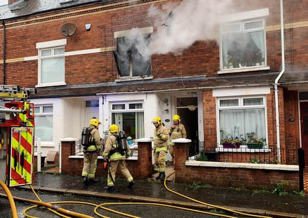 Firefighters at a house fire in east Belfast on March 9