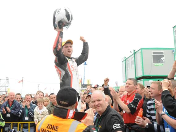 Michael Dunlop is hoisted aloft after winning the 250cc race at the North West 200 in 2008.