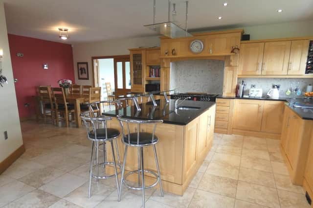The property features a large kitchen/dinette/living room