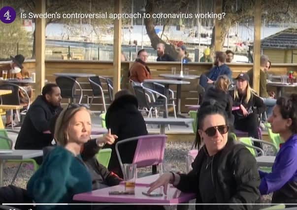 A cafe open in Sweden this week when the rest of Europe is in lockdown, as shown on Channel Four News