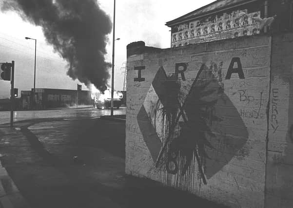 Burnt out vehicles litter the streets of west Belfast after night of rioting in response to the shooting of three IRA members while on a bombing mission in Gibraltar in 1988. Photo: Pacemaker