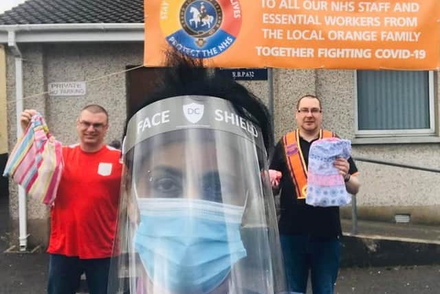 Conlig Village Star LOL 695 pass on a consignment of 55 grade 1 face shields, a supply of hand sanitisers, 20 full sets of nurses scrubs and hand-knitted face mask connectors to an independent care home