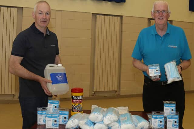 Part of a consignment of PPE to be delivered being checked over by Deputy District  Master of Omagh District No 11, David Swann, and Worshipful District Master of Omagh District No 11, Robert Cummings in Killycurragh Orange Hall