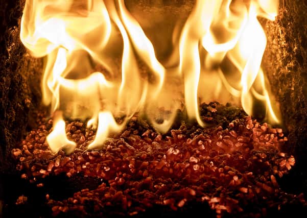 Pellets burning inside a biomass boiler on the farm of a poultry farmer. Photo: Liam McBurney/PA Wire