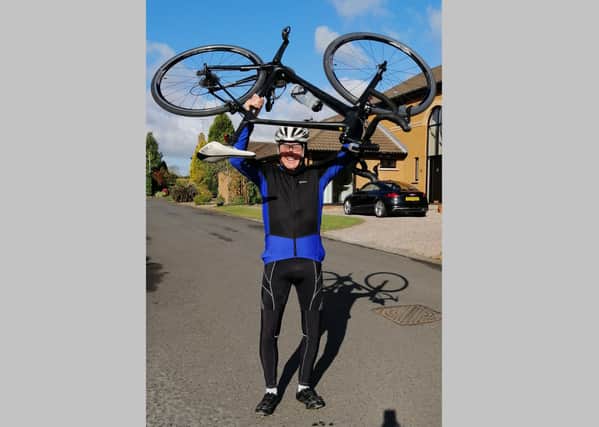 Nigel Quinn after he completed cycling the equivalent distance of a marathon, before walking the equivalent of a marathon round his house in south Belfast, on Saturday May 2 2020 in substitution of the cancelled Belfast marathon due to lockdown