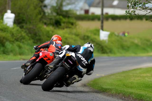 Michael Dunlop in hot pursuit of Ryan Farquhar at Tandragee in 2012.