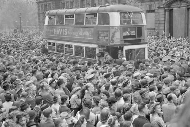 Crowds celebrate in Whitehall. 8 May 1945