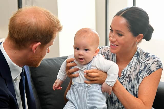 File photo dated 25/09/19 of Britain's Prince Harry and his wife Meghan, Duchess of Sussex, holding their son Archie