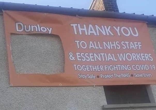 NHS banner at Orange Hall in Dunloy with union flag cut off by vandals