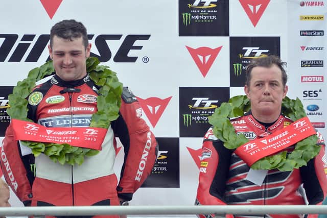 Superbike TT winner Michael Dunlop on the podium with his Honda TT Legends team-mate, John McGuinness in 2013.
