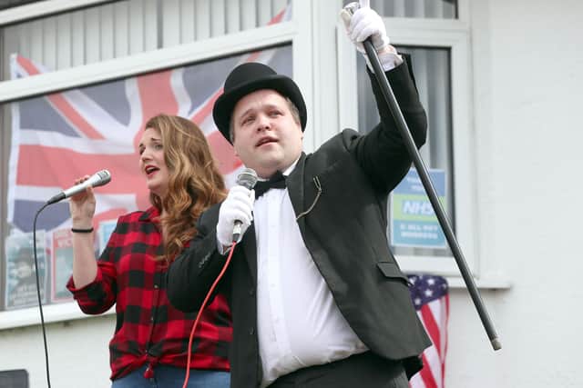 PACEMAKER,BELFAST, 8/5/2020: Belfast Councillor Nathan Anderson, dressed as Winston Churchill, and his wife Rachel lead a singalong in the Newtownbreda area of Belfast to commemorate the 75th anniversary of VE Day.   
PICTURE BY STEPHEN DAVISON