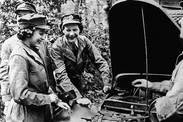 Embargoed to 2100 Friday May 08

File photo dated 01/01/45 of Queen Elizabeth II, then Princess Elizabeth learning vehicle maintenance on an Austin 10 Light Utility Vehicle while serving with No 1 MTTC at Camberley, Surrey. The Queen was surrounded by historic personal mementos from the war years as she addressed the nation on the 75th anniversary of VE Day. PA Photo. Issue date: Friday May 8, 2020. See PA story MEMORIAL VE Queen Mementos. Photo credit should read: PA/PA Wire