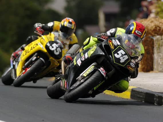 Ray Porter leads Darran Lindsay at the Athea road races in Co Limerick in 2004.