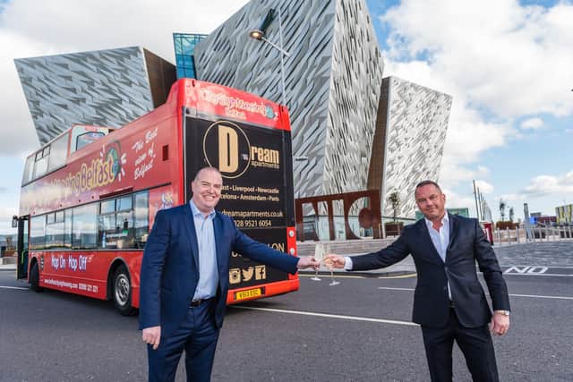 Tom Smyth Managing Director of Dream Apartments is pictured with Paul Cunningham, City Sightseeing Belfast